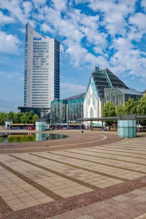 Morning atmosphere, Leipzig Augustusplatz with city skyscraper and university, reflection, water