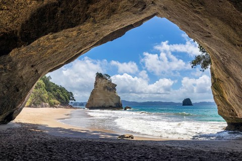 The iconic Mautohe Cathedral Cove, a gigantic arched cavern that passes through a rock headland to