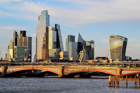 Blackfriars Bridge in front of the City of London skyline with skyscrapers 22 Bishopsgate,