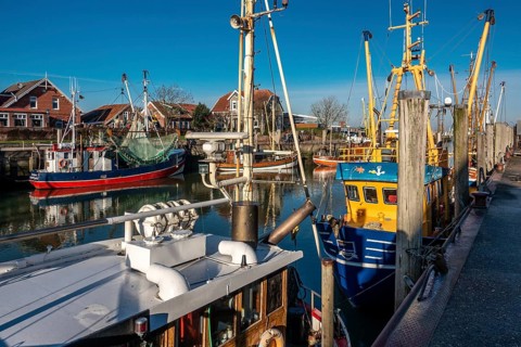 The port of Neuharlingersiel, East Frisia, Lower Saxony, fishing boats, fishing trawler, memorial,