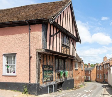 Historic buildings timber framed Angel pub and Angel Lane, town of Woodbridge, Suffolk, England, UK