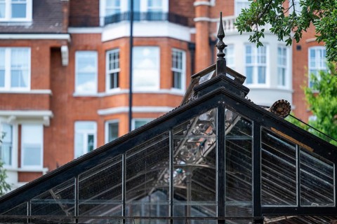 Victorian townhouses on Royal Hospital Road, historic greenhouse in the Chelsea Physic Garden