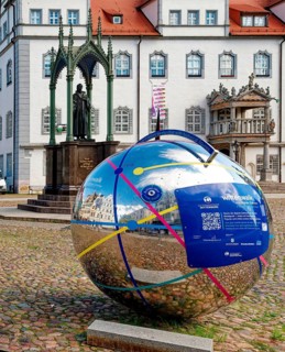 Market square with town hall and globe with QR code for historical apps, Luther city Wittenberg,