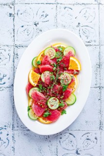 Sicilian tuna crudo, on a white plate, Italian dish, homemade, no people