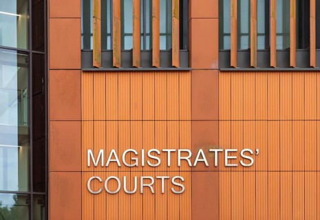 Sign for Magistrates' Courts on side of court building, Colchester, Essex, England, UK designed by