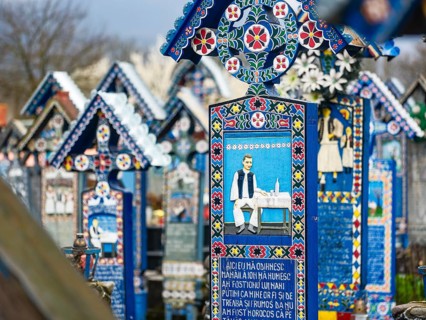 Colourfully painted wooden crosses in the cheerful Cimitirul Vesel cemetery, Sapân?a, Maramure?,