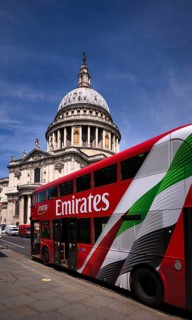 Double-decker bus, advertisement, EMIRATES airline logo, behind St Paul's Cathedral, St. Paul's