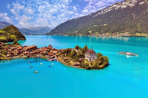 View of Iseltwald from above, peninsula in Lake Brienz with steamboat, Canton of Bern, Switzerland