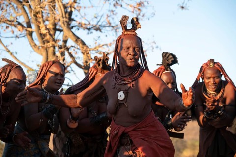 Himba woman dancing euphorically, traditional dance, traditional Himba village, Kaokoveld, Kunene,