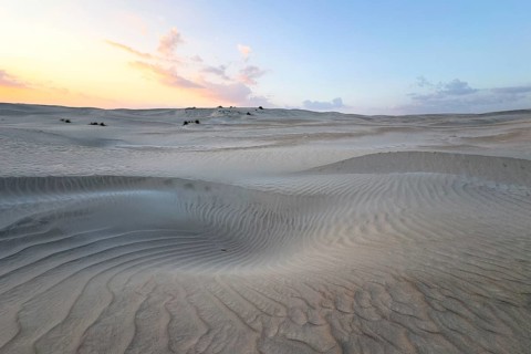 Sunset, white sand dunes in the Khaluf desert, Oman