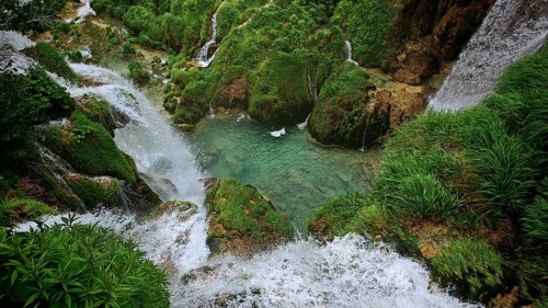 View from above of bubbling waterfalls and a clear pond, Plitvice Lakes National Park, Croatia