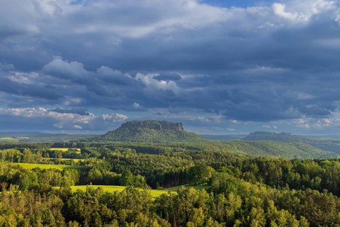 View of Lilienstein from Gamrig sandstone rock in rainy weather and sunshine, Rathen, Saxony,