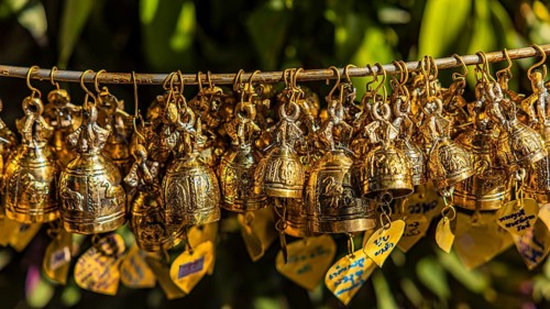 Small prayer bells strung on a pole, Wat Phra That Doi Suthep temple complex, Chiang Mai, Thailand