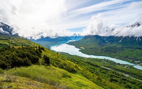 View of snowy mountains in spring and turquoise blue Kenai Lake, Slaughter Ridge Trail, Cooper