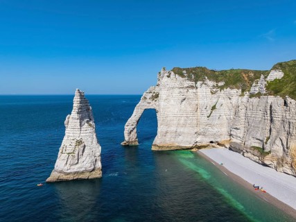 Aerial view of the Porte d'Aval rock formation, a landmark on the chalk coast with the distinctive