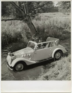 Car, coupé, advertising photo, on the edge of the lake, A vintage car carefully crosses a shallow