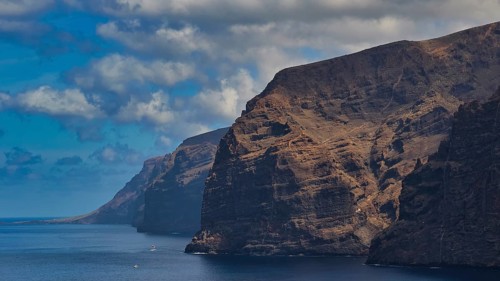 Los Gigantes, Calm sea and dramatic rocks under a cloudy sky in natural surroundings, Masca,