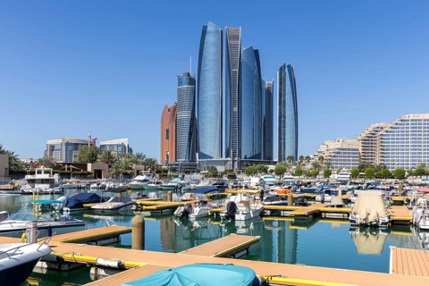 Abu Dhabi Skyline Etihad Towers skyscrapers with marina yacht harbor in Abu Dhabi, United Arab