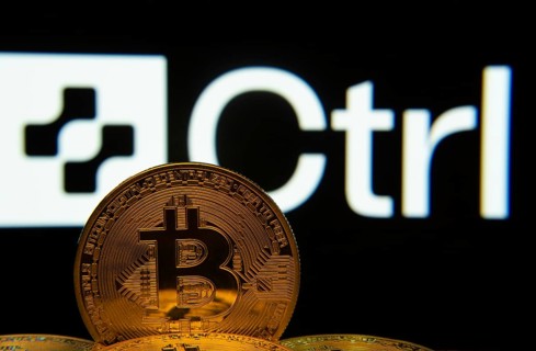 Dhaka, Bangladesh- 27 March 2025: Close-up of Bitcoin coins with the Ctrl Wallet logo visible on a