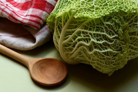 Savoy cabbage, and cooking spoon