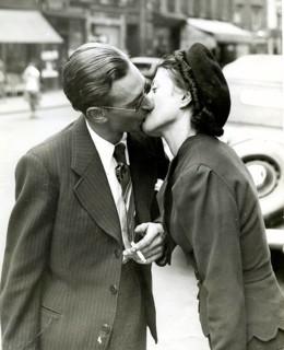 Kiss, love, farewell, thirties, a couple kissing each other lovingly on a busy street in a city, a