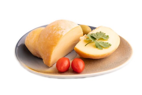 Smoked Mozzarella cheese, with tomatoes and olives isolated on white background, side view, copy