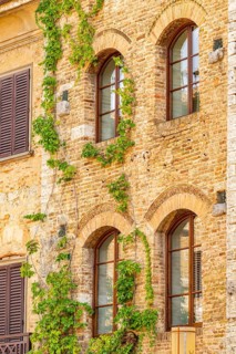 Old town with historic buildings at San Gimignano on a sunny day, Tuscany, UNESCO World Heritage,