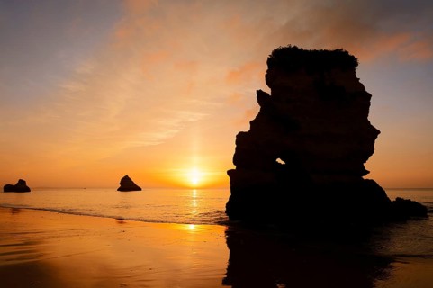 Rock formation on the coast at sunrise, Praia Dona Ana, Lagos, Algarve, Portugal