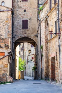 Old Town with stone arches and historic buildings of San Gimignano, Tuscany, UNESCO World Heritage,