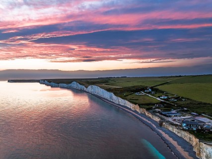 Sunset over Seven Sisters Cliffs from a drone, English Channel, East Sussex, South-east England