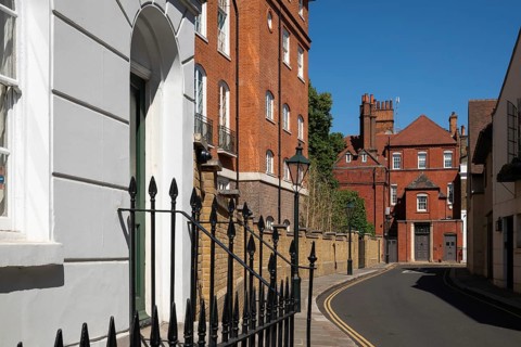 Narrow street lined with historic brick buildings, quiet residential area, Chelsea, London, Great