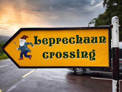 Yellow road sign, leprechaun crossing the road, tourist attraction and humorous reference to Irish
