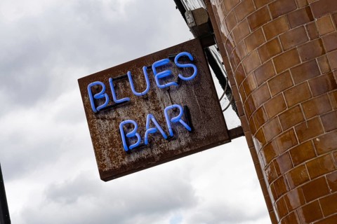 Neon sign for a Blues Bar in Camden Town, London, a popular neighbourhood of the city for nightlife