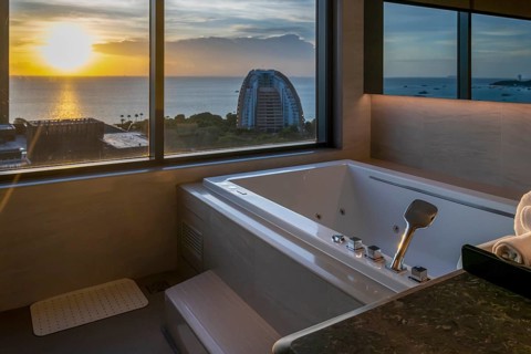 Hotel bathroom hot tub with view, Pattaya, Thailand