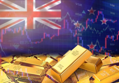 Gold bars on New Zealand flag in background. Gold bars stacked on New Zealand flag. Concept of New