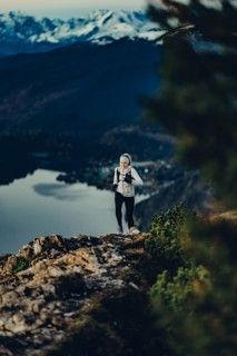 Trail running in autumn on the Jochberg on Lake Walchensee against the wonderful backdrop of the