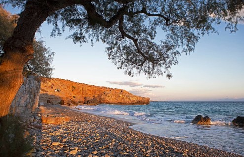 Orange rocks on Koutelo Beach or beach at sunset, Vouvas near Chóra Sfakion, Chania Regional Unit,