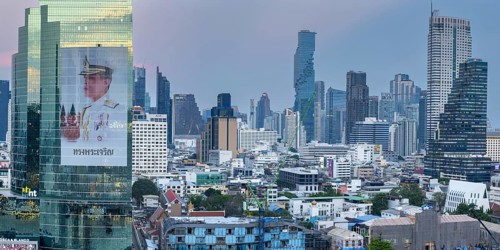 Panoramic sunset view from IconSiam over Mae Nam Chao Phraya to Bangkok's skyline. On display