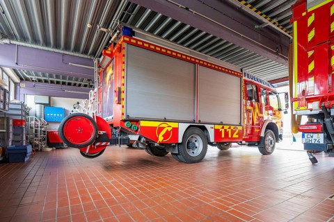 Fire engine in a garage with detailed view of the front of the vehicle and equipment, Gechingen