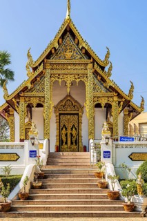 Artfully decorated gable roof with gilded ornaments, Buddhist temple complex Wat Phra That Si Chom
