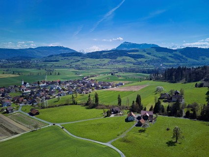 View of the village with the Alps with the Rigi in the background, Dietwil, Freiamt, Canton of