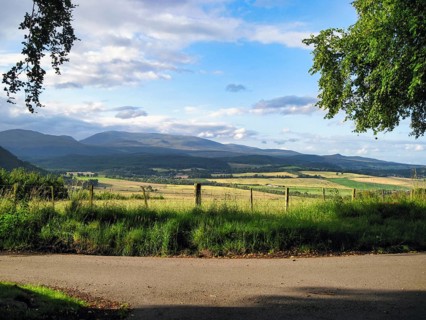 View over fields on mountain range, Cumulus, Marybank, Muir of Ord, Strathconon Glen, Scottish