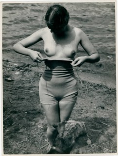 Bathing, swimsuit, undressing, nude, woman at the lake in natural surroundings, the sun shining