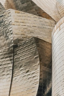 Exterior view of the Guggenheim Museum with light-reflecting titanium plates in Bilbao, Spain