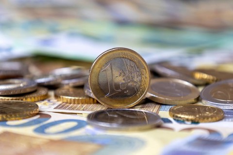 Close-up of euro banknotes and euro coins