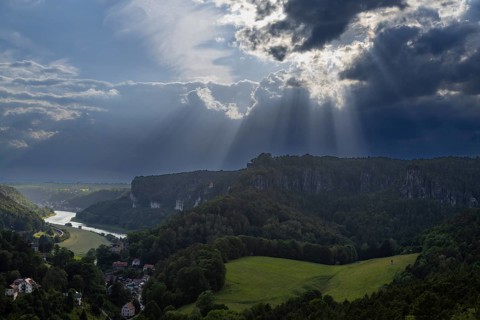 View from Gamrig sandstone rock in rainy weather and sunshine, Rathen, Saxony, Germany