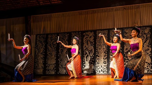 Young Thai women in traditional dress showing a traditional dance, Old Chiang Mai Cultural Center,