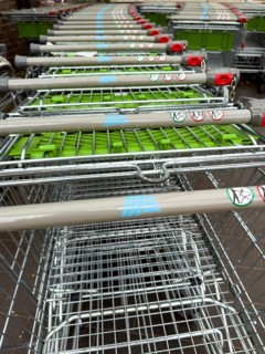 Shopping trolleys pushed into each other in front of Aldi supermarket discounter, international