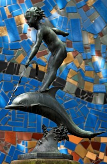 Girl sitting on a dolphin, sculpture in Nuremberg Zoo, Nuremberg, Middle Franconia, Bavaria,