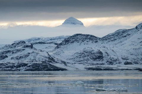 One of the three Tee Kroner (Three Crowns) mountains, partly shrouded in cloud, Kongsfjord or